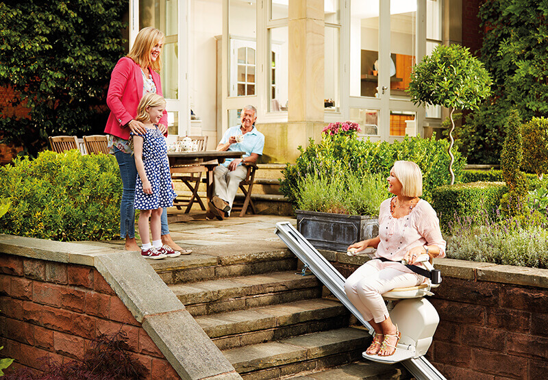 Lady with family and outdoor stairlift